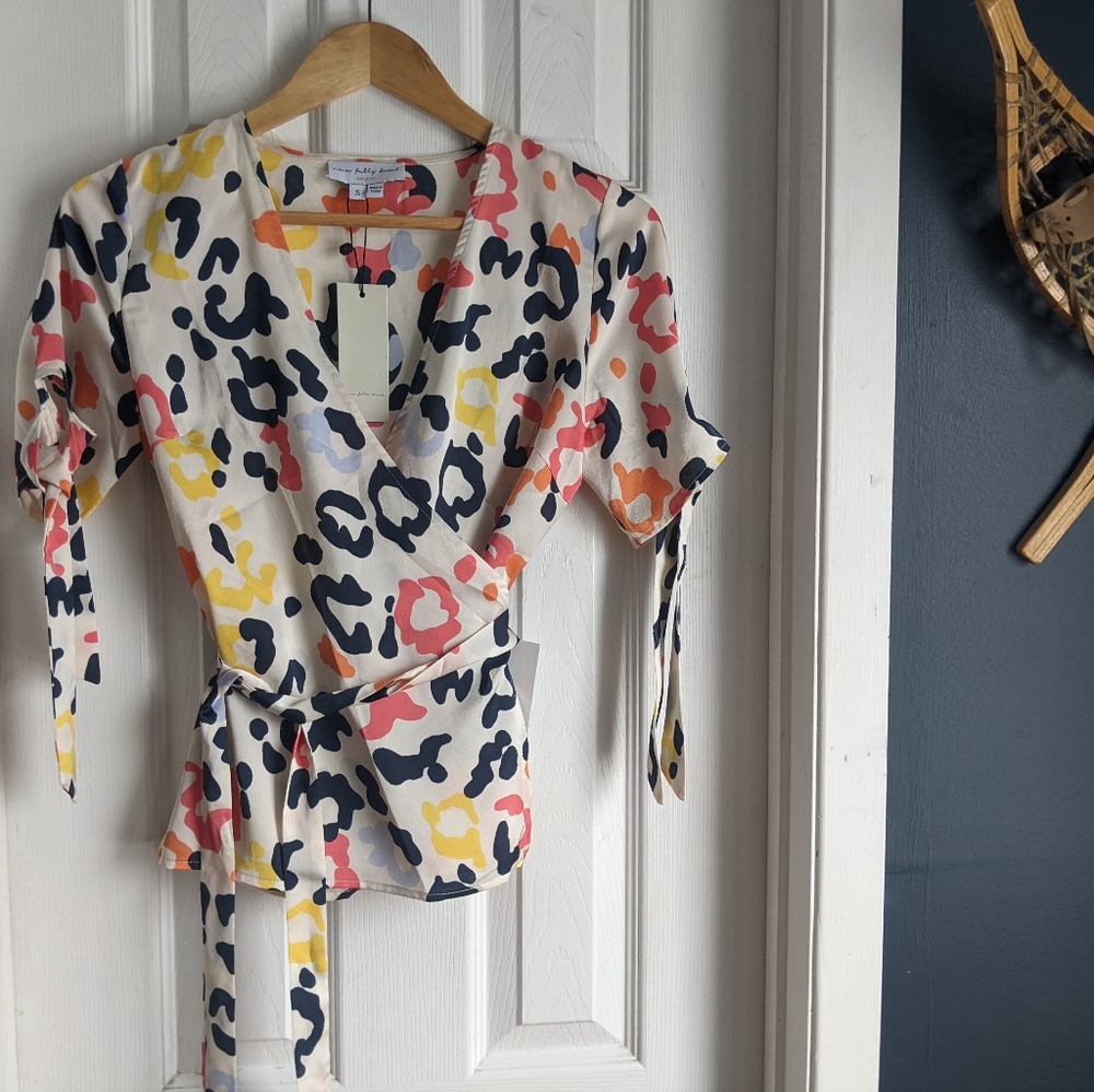 NWT Never fully dressed wrap top size small